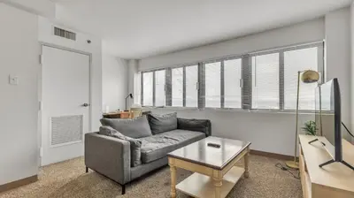 a living room with a couch and a table at PP 1506 Beautiful Professional 1br Apt, Pool in Harrisburg