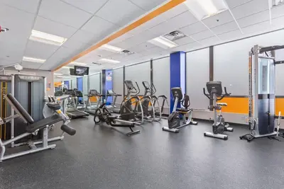 a gym with several treadmills and cardio machines at PP 1506 Beautiful Professional 1br Apt, Pool in Harrisburg