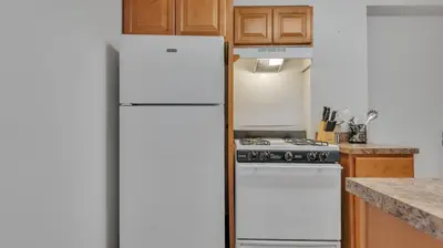 a white refrigerator in a kitchen with a stove at PP 1606 Beautiful Professional 1br Apt, Pool in Harrisburg