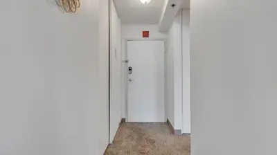 an empty corridor with a white door in a building at PP 1606 Beautiful Professional 1br Apt, Pool in Harrisburg