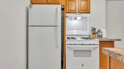 a white refrigerator in a kitchen with a stove at PP 2006 Beautiful Professional 1br Apt, Pool in Harrisburg