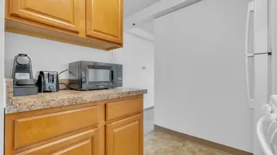 a kitchen with a counter top with a microwave at PP 2006 Beautiful Professional 1br Apt, Pool in Harrisburg