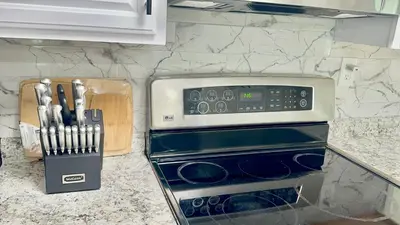 a kitchen counter with a microwave and some utensils at Town & Country Andover, NJ Area Apt- 2nd FL in Andover