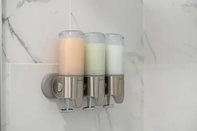 a group of glass jars hanging on a wall at 