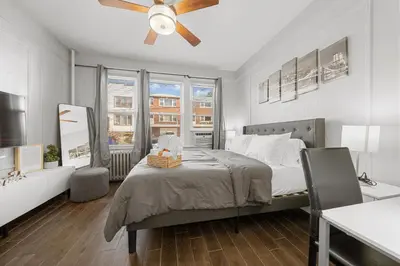 a bedroom with a bed and a ceiling fan at 