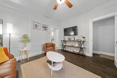a living room with a couch and a table at 