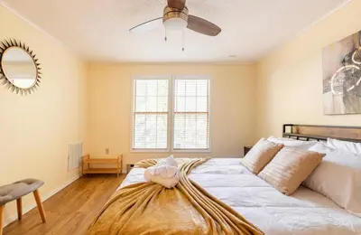 a bedroom with a bed and a ceiling fan at The Escape in Albrightsville