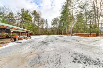 an empty road in front of a building at Shared Perks Deluxe Cabin B at Elk Creek Escape! in Hillsgrove