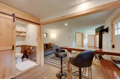 a room with a desk and a chair in a room at Shared Perks Deluxe Cabin B at Elk Creek Escape! in Hillsgrove