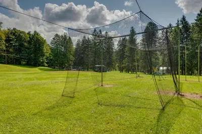 a net in the middle of a field at Hillsgrove Deluxe Cabin E Close to Hiking in Hillsgrove