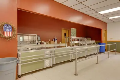 a cafeteria with a row of sinks and counters at Pet-Friendly Deluxe Cabin F with Grill in Hillsgrove in Hillsgrove