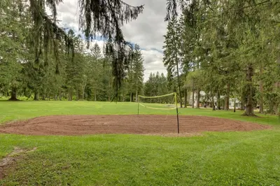 a park with a net in the middle of a field at 9 Mi to Worlds End State Park Deluxe Cabin H in Hillsgrove