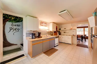 a kitchen with white cabinets and a counter top at The Big House at Elk Creek Escape with Game Room in Hillsgrove