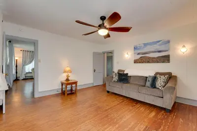 a living room with a couch and a ceiling fan at The Big House at Elk Creek Escape with Game Room in Hillsgrove