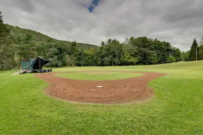a dirt pitchers mound on a golf course at The Big House at Elk Creek Escape with Game Room in Hillsgrove