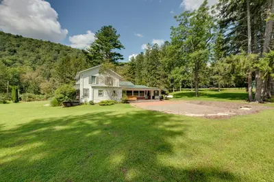 a home with a large yard with a house at The Big House at Elk Creek Escape with Game Room in Hillsgrove
