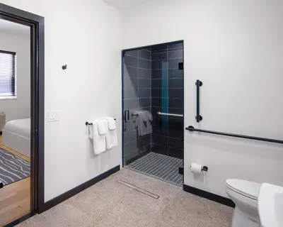 a bathroom with a shower and a toilet at Kasa The Niche University City Philadelphia in Philadelphia