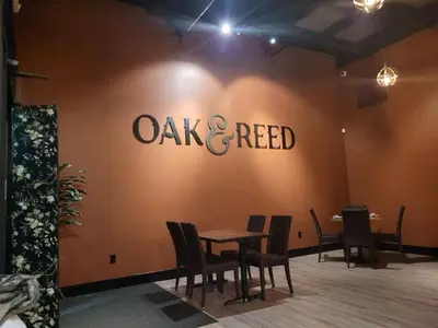 a restaurant with a table and a sign on the wall at Cottage Suites in Middletown