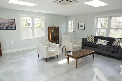 a living room with a couch and chairs and a table at Spacious Modern Home in West Freehold in Stonehurst West