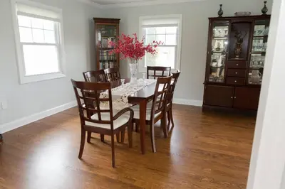 a dining room with a table and chairs at Spacious Modern Home in West Freehold in Stonehurst West