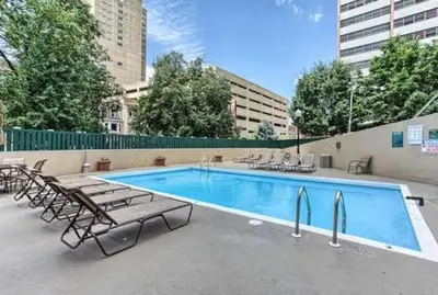 a swimming pool with chaise lounge chairs at PP 2107 Beautiful 1Br Apartment I Free Parking in Harrisburg