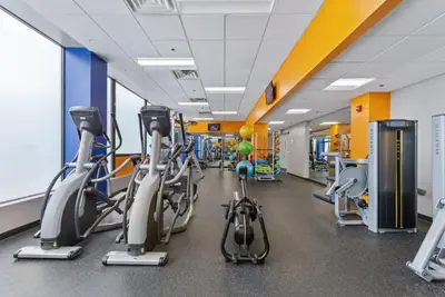 a gym with cardio bikes and treadmills at PP 2401 Modern Corporate 2br Suite pool, Gym in Harrisburg