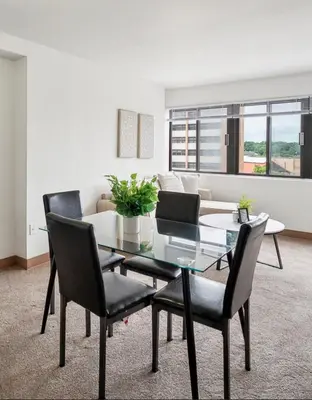 a dining room with a glass table and chairs at PP 501 Harrisburg Gem 2br, Pool, Parking in Harrisburg