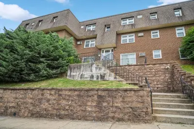 a brick building with stairs in front of it at Pine Brook 104 I Pool Gym I Free Parking ! in Newark