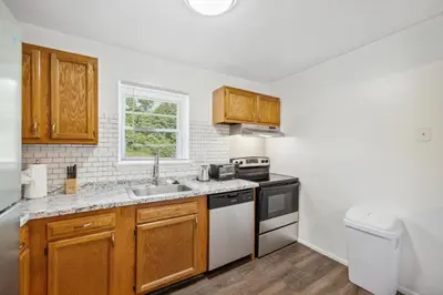 a kitchen with a sink and a stove top oven at Pine Brook 1108 I Pool Gym I Free Parking ! in Newark