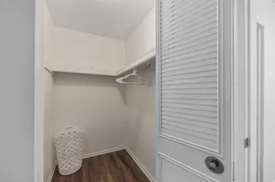 a room with a closet with a door and a trash can at Pine Brook 1122 I Pool Gym I Free Parking ! in Newark