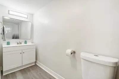 a white bathroom with a sink and a mirror at Pine Brook 1218 I Cozy & comfy I Free Parking in Newark