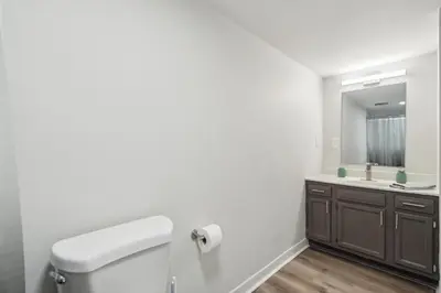 a bathroom with a toilet and a sink at Pine Brook 124 I Modern Gem I Free Parking in Newark