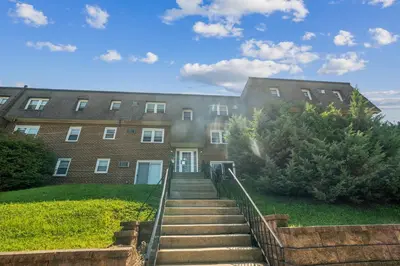 a large brick building with stairs in front of it at Pine Brook 124 I Modern Gem I Free Parking in Newark