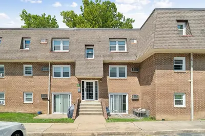a brick building with stairs in front of it at Pine Brook 518 I Spacious 2Bd Garden Style Oasis in Newark
