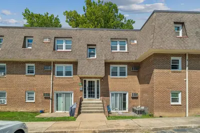 a brick building with stairs in front of it at Pine Brook 618 I Cozy & Roomy I Gym & Pool in Newark