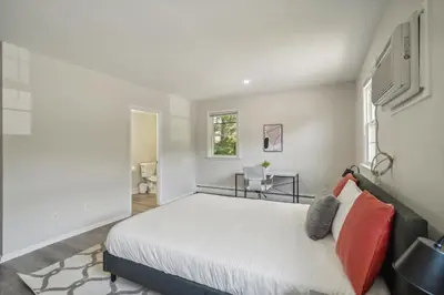 a bedroom with a bed and a window at Pine Brook 618 I Cozy & Roomy I Gym & Pool in Newark