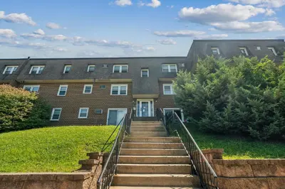 a staircase leading up to a brick building at Pine Brook 908 I Lovely 2Bd Spacious Apartment in Newark