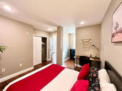 a bedroom with a bed and a desk in it at 404 Rose in the city 1 BD living room in center city in Philadelphia