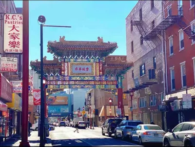 a street with a gate in the middle of a city at 404 Rose in the city 1 BD living room in center city in Philadelphia
