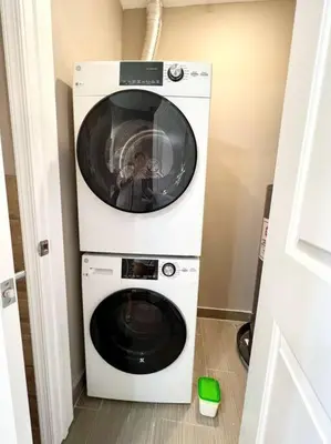 a washer and dryer in a small room at 403 Luxury and Comfy King bed in Central city of phily in Philadelphia