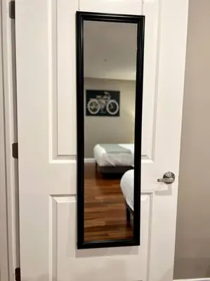 a mirror on the door of a room at 406 Luxury KING BED in central city of Philad in Philadelphia