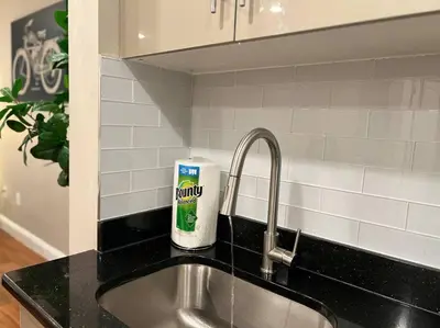 a kitchen sink with a can of toothpaste next to it at 406 Luxury KING BED in central city of Philad in Philadelphia
