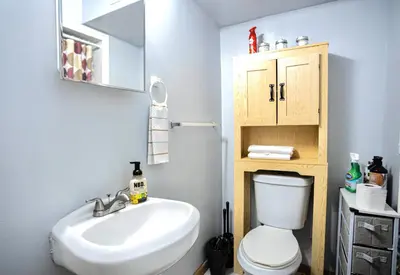 a bathroom with a white toilet and a sink at Lovely Loft in Newark Minutes from NYC, EWR & American Dream Mall in Newark