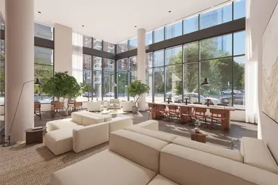 a living room with couches and tables and windows at One Grove in Jersey City in Jersey City