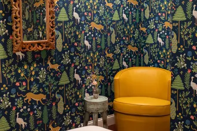 a yellow chair in a bathroom with a wallpaper at Your Perch at University City in Philadelphia