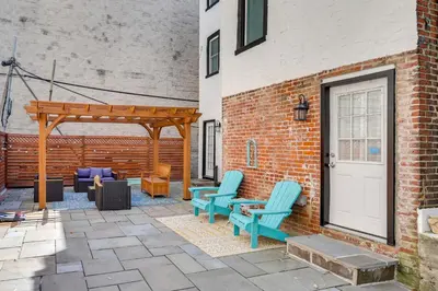 a patio with two chairs and a gazebo at Your Perch at University City in Philadelphia
