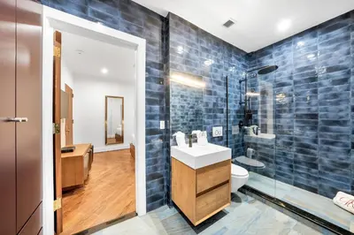 a bathroom with a sink and a toilet and a shower at Landmarked NYC Townhome - Sleeps 10 -Group-Friendly in New York