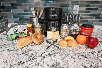 a counter top with a bunch of food on it at Hidden Gem-1Bedroom with Plenty Free Street Parking in Communipaw