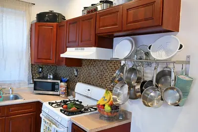a kitchen with a stove with pots and pans at Lovely Victorian Home with Bed and Breakfast Energy in West Bergen