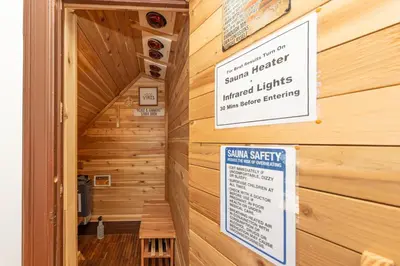 a sauna with a sign on a wooden wall at 3 Bedroom Gem! King, Full & Twin Beds, Sauna with Free Parking plus more in Jersey City